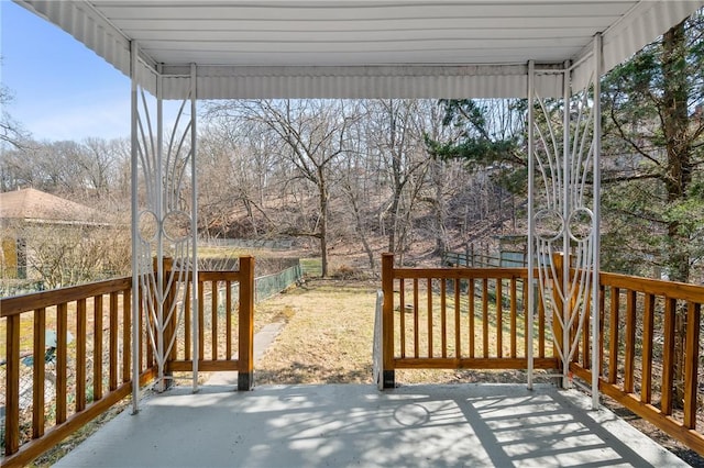 wooden terrace featuring a patio