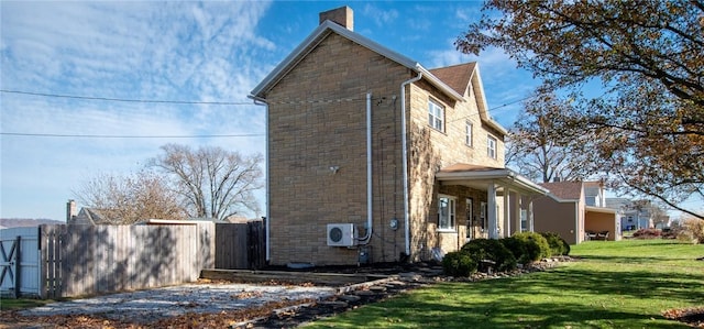 view of home's exterior with a lawn