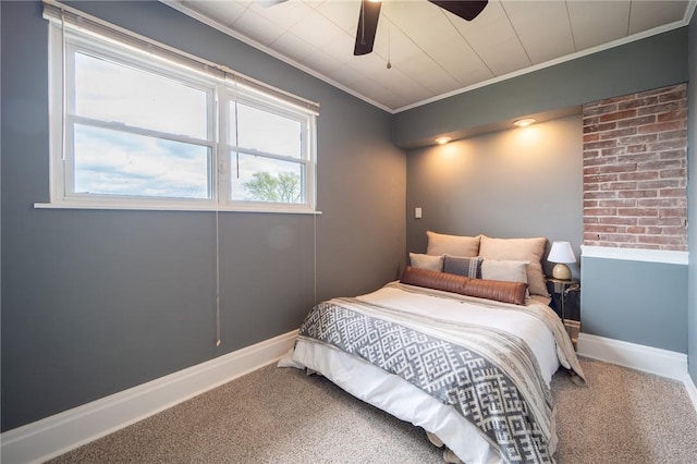 bedroom featuring carpet, ceiling fan, and crown molding