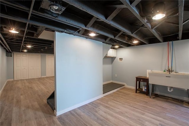 basement featuring hardwood / wood-style flooring