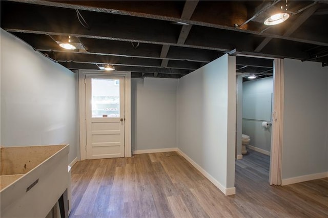 basement with wood-type flooring