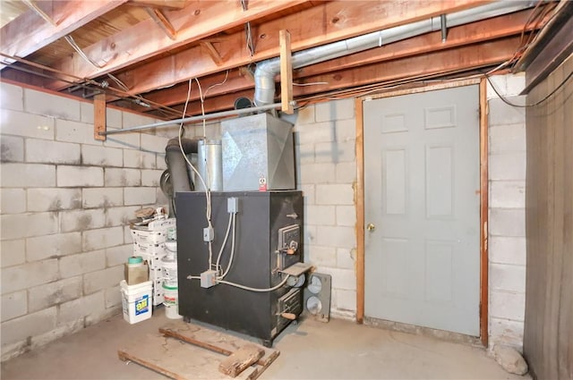 utility room featuring heating unit