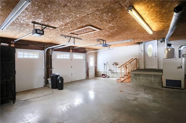 garage with heating unit and a garage door opener