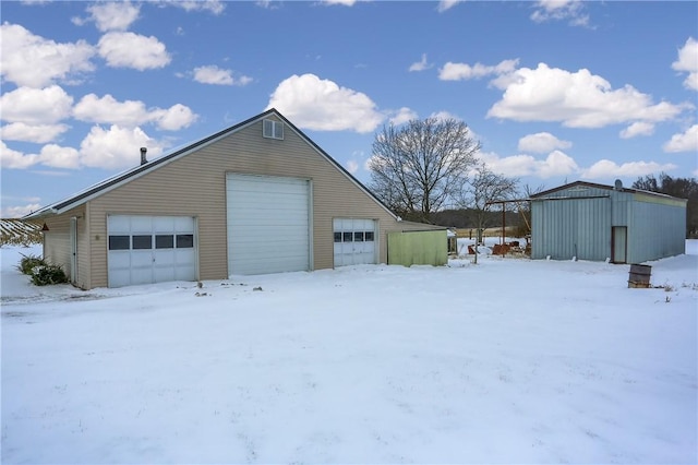 view of snow covered garage