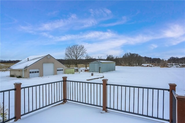 exterior space with a garage and a storage shed