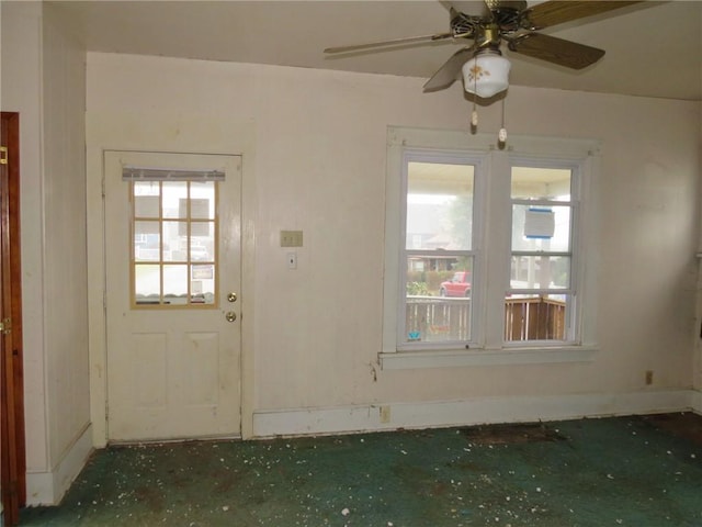 interior space featuring ceiling fan