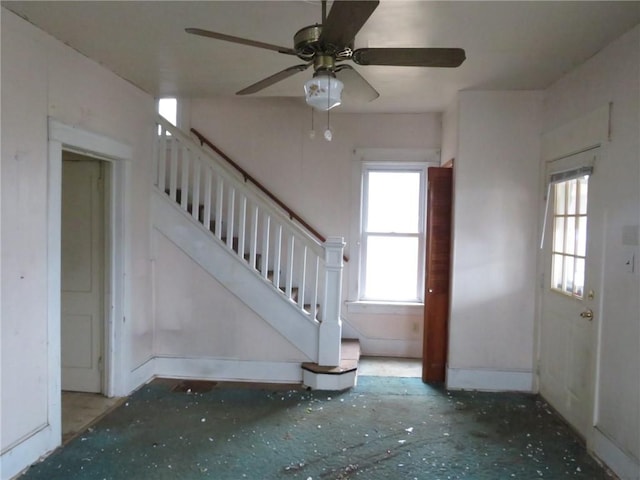 foyer with plenty of natural light and ceiling fan