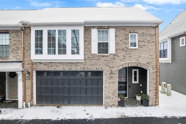 multi unit property featuring a garage