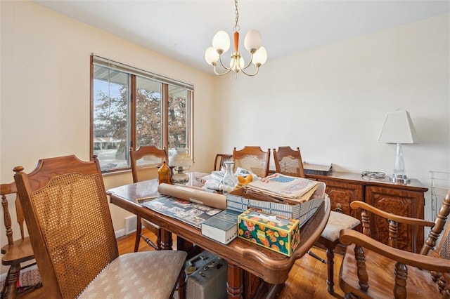 dining space featuring a chandelier and hardwood / wood-style floors