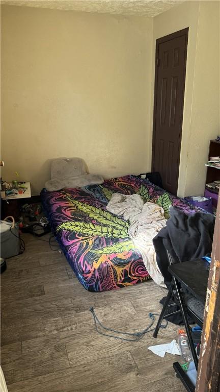 bedroom featuring hardwood / wood-style flooring