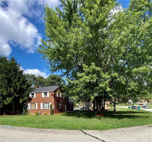 view of home's exterior featuring a yard