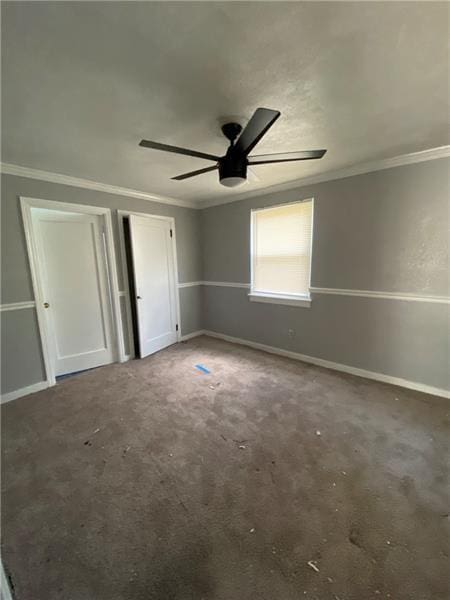 unfurnished bedroom featuring ceiling fan and crown molding