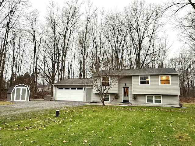 raised ranch featuring a garage, a shed, and a front yard