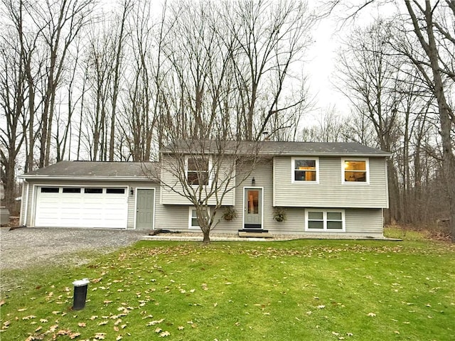 raised ranch with a front yard and a garage