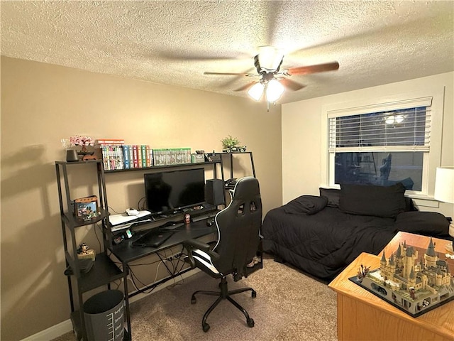 carpeted bedroom with a textured ceiling and ceiling fan