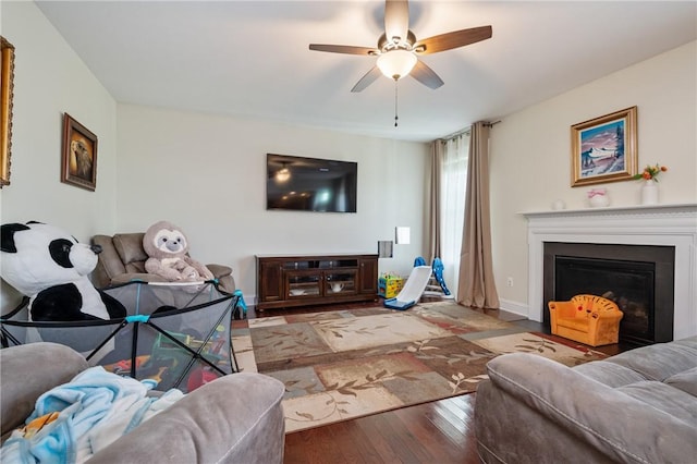 living room with hardwood / wood-style floors and ceiling fan