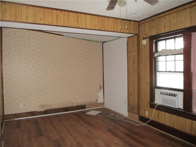 spare room with ceiling fan, cooling unit, and dark hardwood / wood-style floors