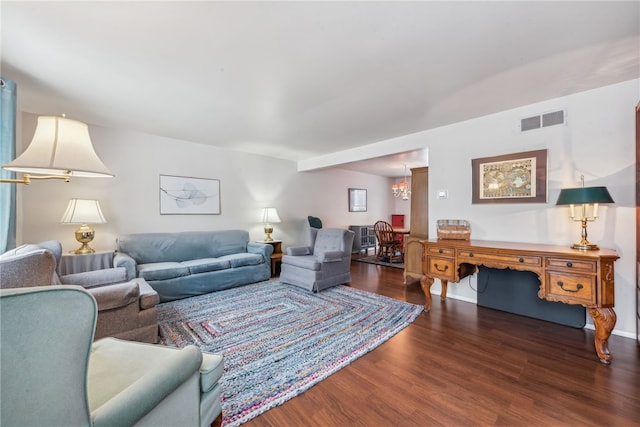 living room with dark hardwood / wood-style flooring