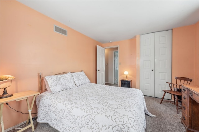 carpeted bedroom featuring a closet