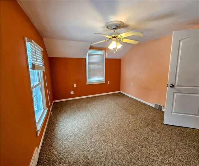 bonus room featuring carpet floors, vaulted ceiling, and ceiling fan