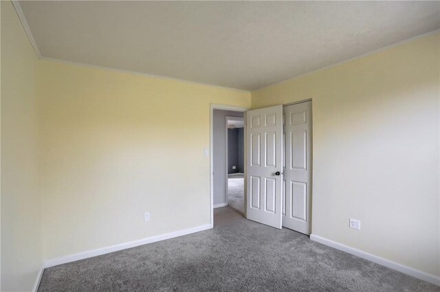 carpeted spare room with ornamental molding