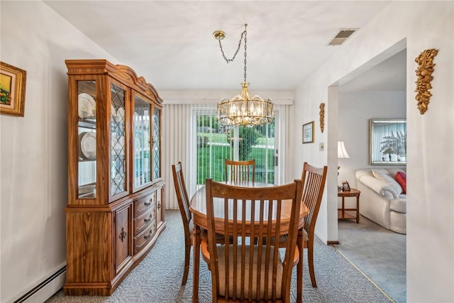 dining area with carpet, a baseboard heating unit, and a notable chandelier