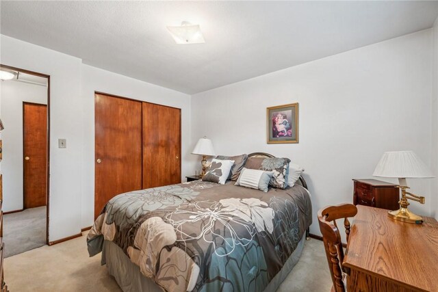 carpeted bedroom with a closet