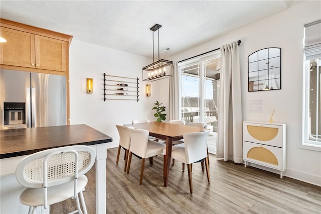 dining area featuring hardwood / wood-style flooring