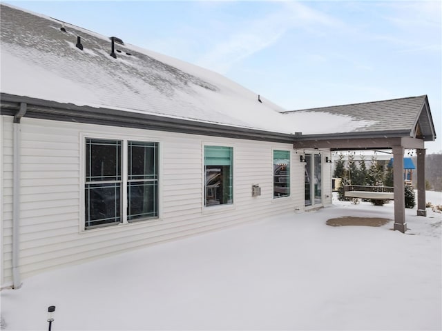 view of snow covered house