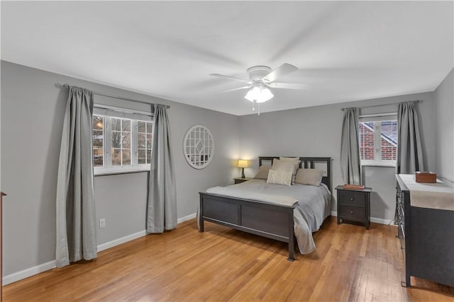 bedroom featuring light wood-type flooring and ceiling fan