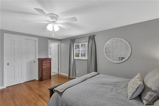 bedroom featuring ceiling fan and light wood-type flooring