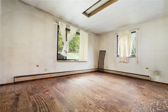 empty room featuring a baseboard heating unit