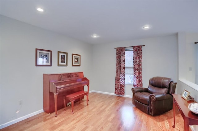 sitting room featuring light hardwood / wood-style floors