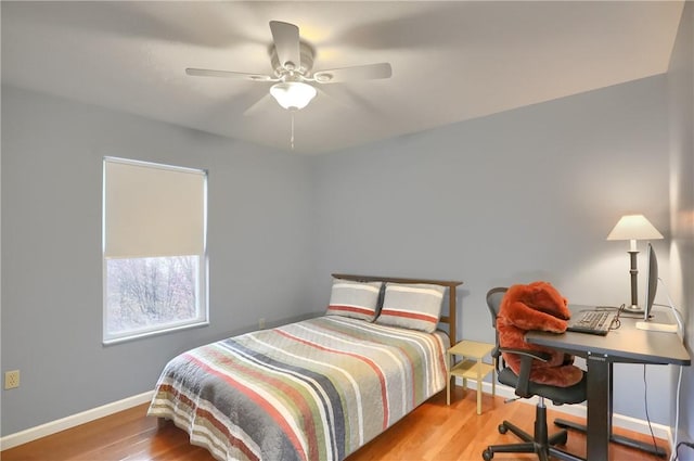 bedroom with ceiling fan and light wood-type flooring