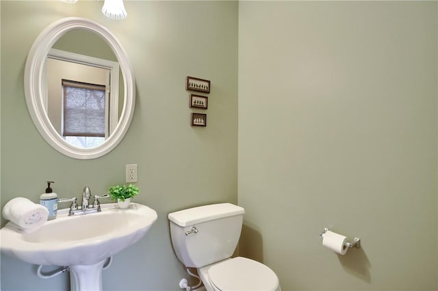 bathroom with toilet and sink