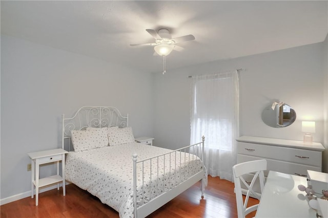 bedroom featuring ceiling fan and dark wood-type flooring