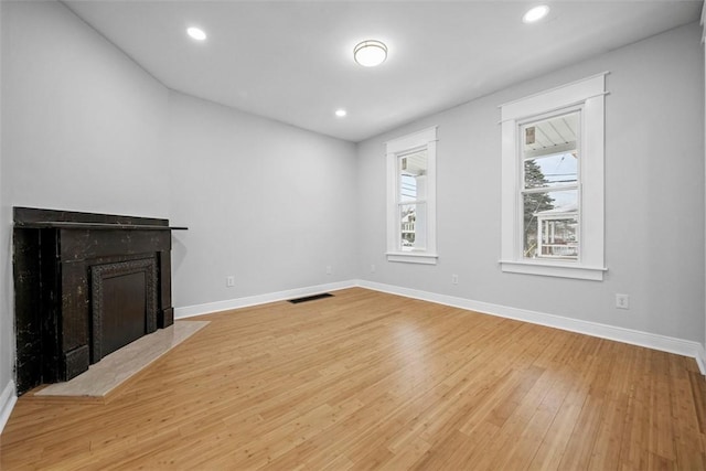 unfurnished living room with light wood-type flooring