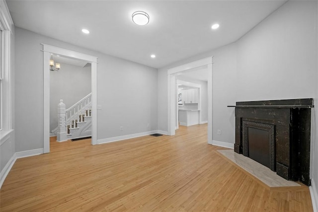 unfurnished living room with light hardwood / wood-style floors