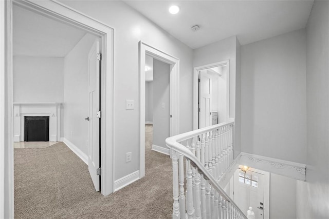 hallway featuring carpet flooring