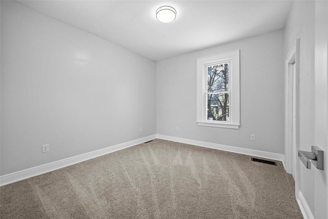 empty room featuring carpet floors