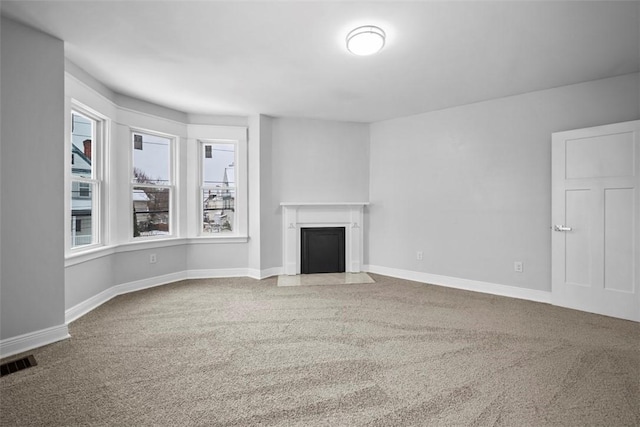 unfurnished living room with carpet