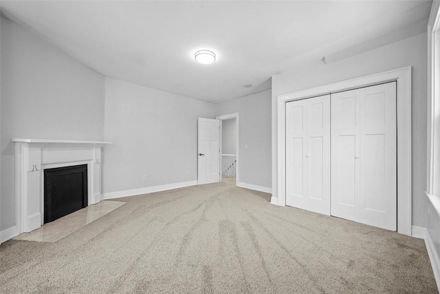 unfurnished living room with carpet