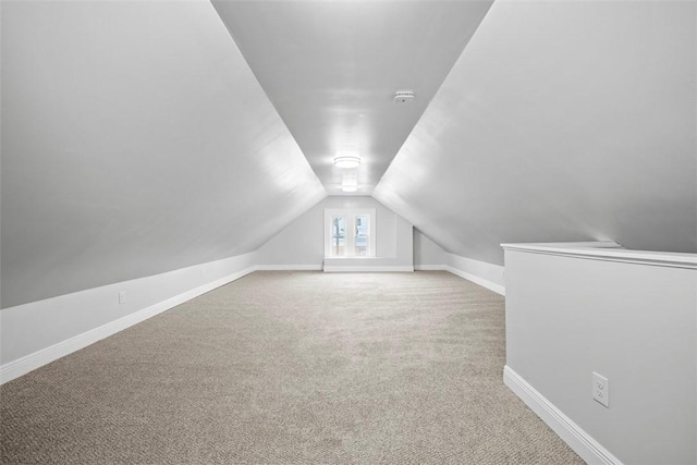 bonus room featuring carpet flooring and lofted ceiling