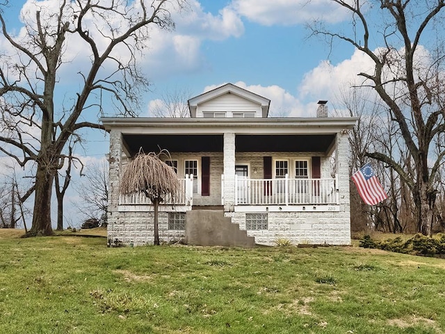 view of front facade with a porch and a front lawn