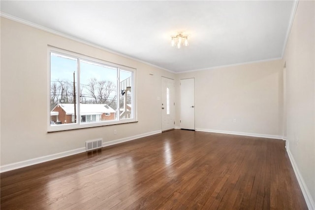 interior space with dark hardwood / wood-style floors and ornamental molding