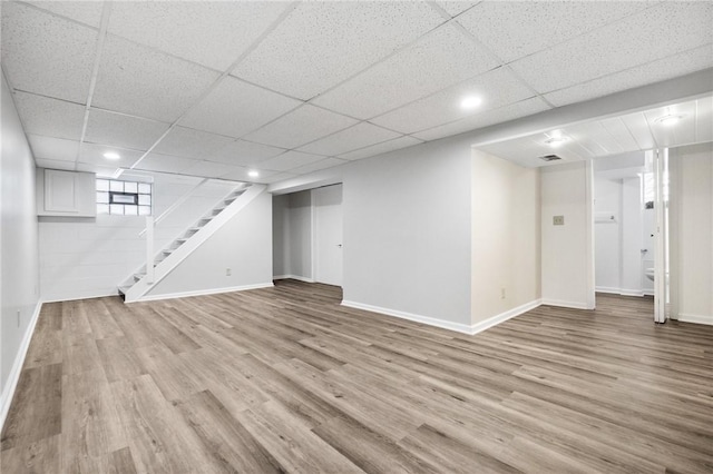 basement featuring light hardwood / wood-style floors