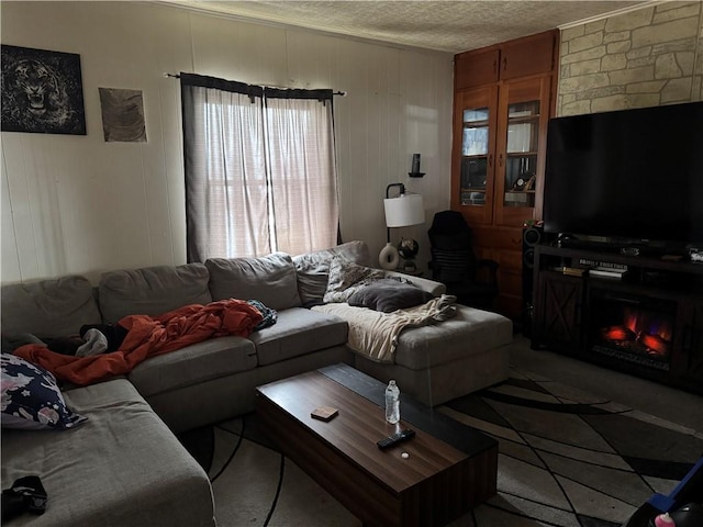 living room featuring a fireplace and a textured ceiling