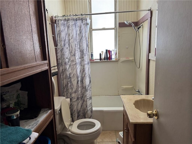 full bathroom featuring tile patterned floors, shower / bathtub combination with curtain, vanity, and toilet