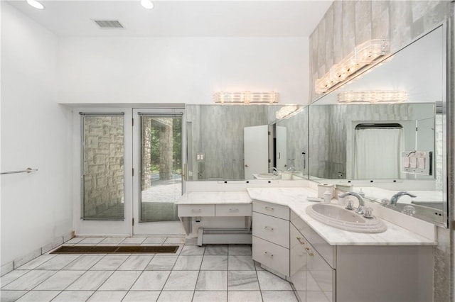 bathroom featuring vanity and a baseboard heating unit