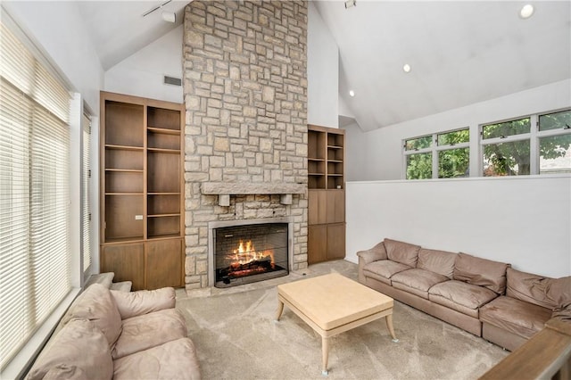 carpeted living room featuring a fireplace and high vaulted ceiling